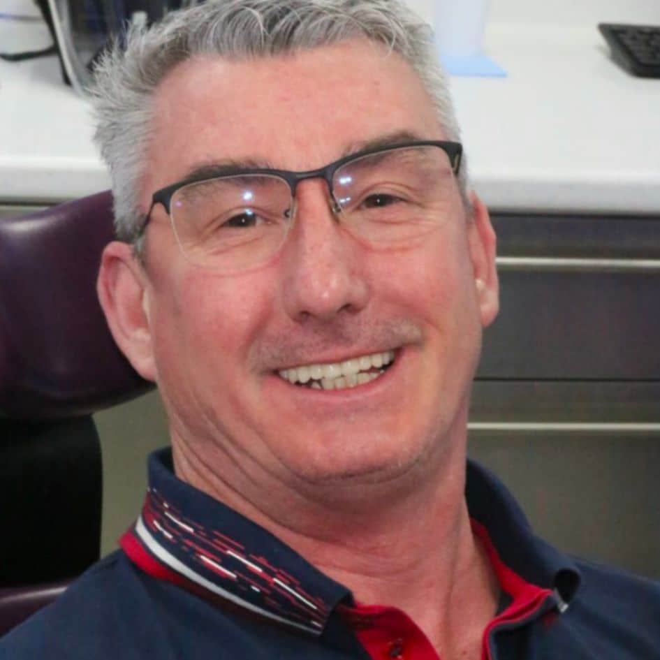 patient face picture after implant treatment in dentist leicester